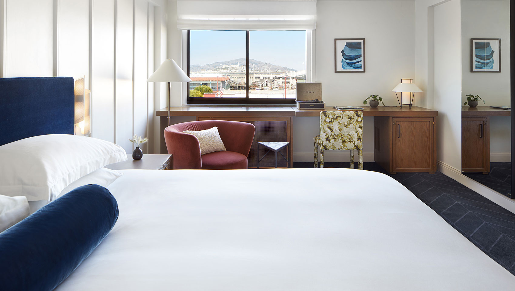 white bed with blue headboard