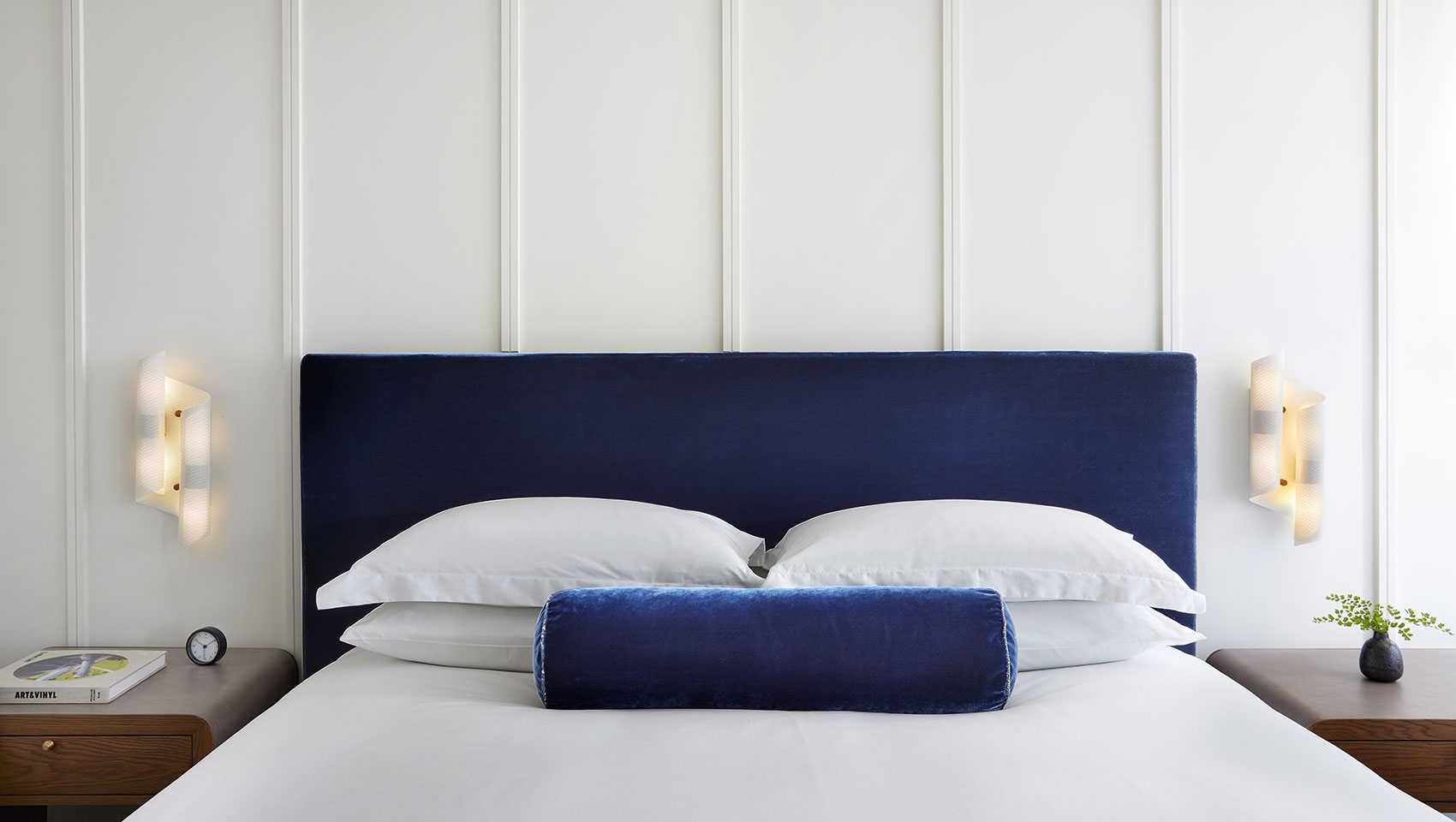 white bed with blue headboard