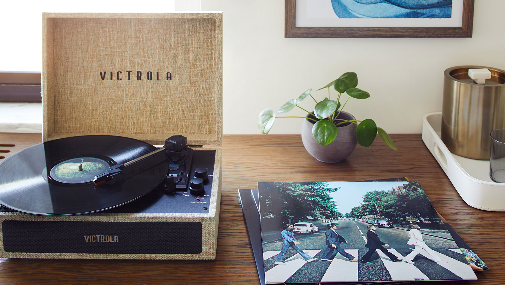 wooden desk work space with record player