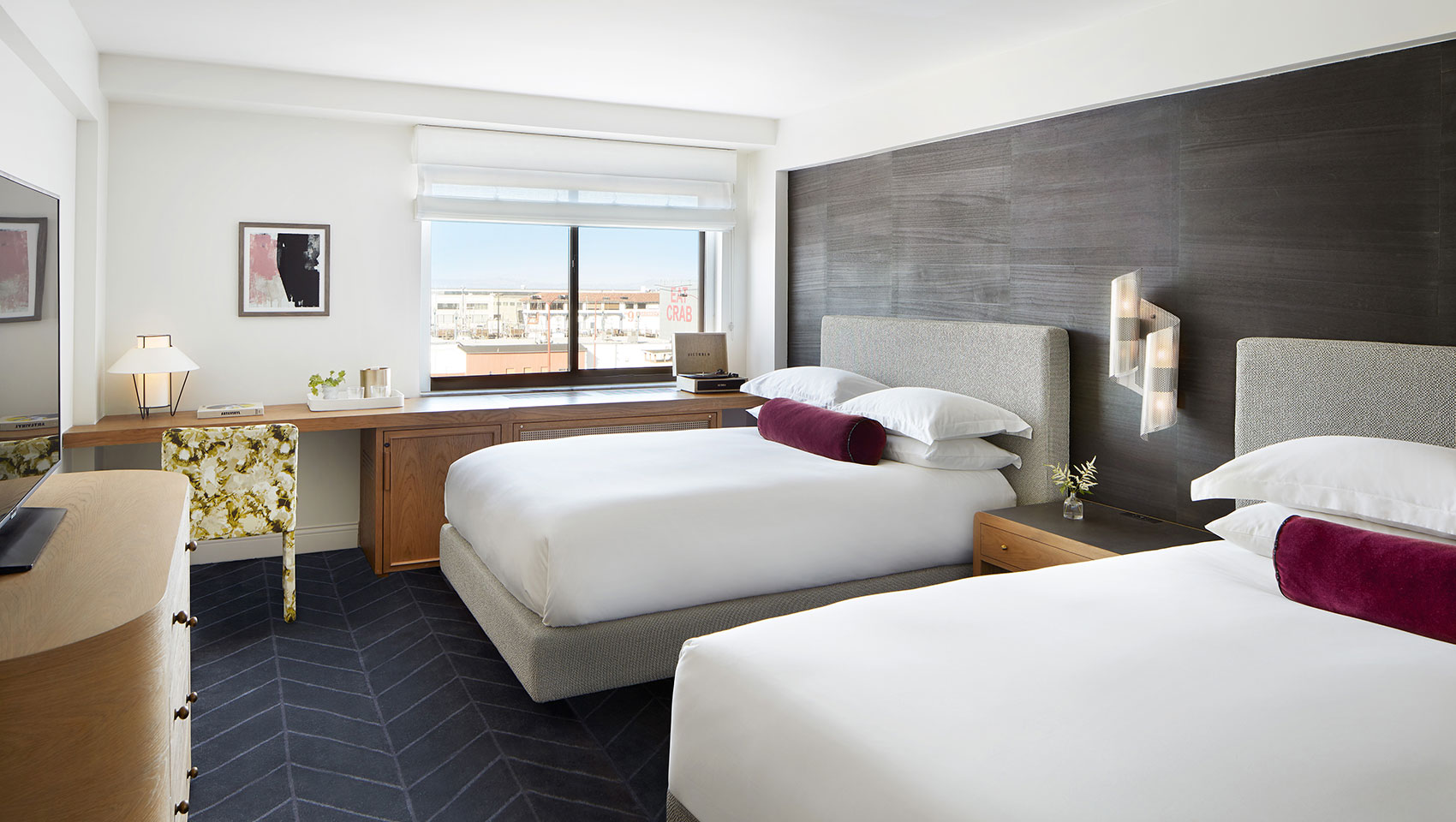 two white queen beds with gray headboards